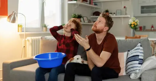 Stressed couple because of roof leak