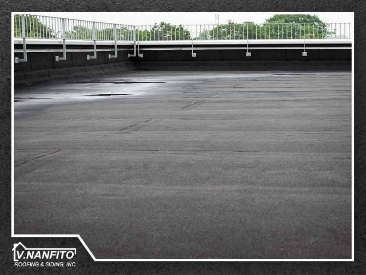Ponding Water on Flat Roofing Causes and Prevention